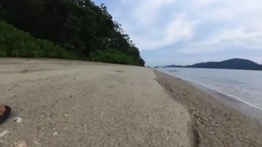 motion footage of walking along the beach