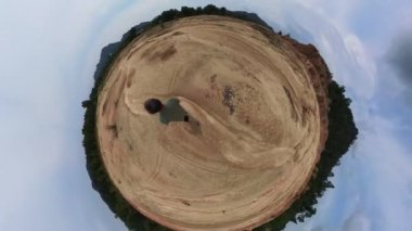 male model walking on the barren and dry land 