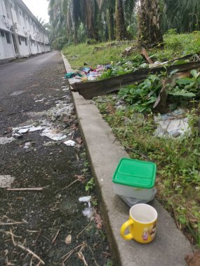 Perak,Malaysia. January 25,2023:Illegal and irresponsible dumping of domestic waste materials along the bushy roadside at Taman Mas 1,Kg Koh.