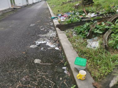 Perak,Malaysia. January 25,2023:Illegal and irresponsible dumping of domestic waste materials along the bushy roadside at Taman Mas 1,Kg Koh.