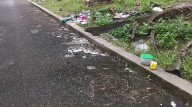Perak,Malaysia. January 25,2023:Illegal and irresponsible dumping of domestic waste materials along the bushy roadside at Taman Mas 1,Kg Koh.