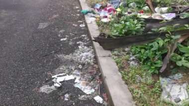Perak,Malaysia. January 25,2023:Illegal and irresponsible dumping of domestic waste materials along the bushy roadside at Taman Mas 1,Kg Koh.