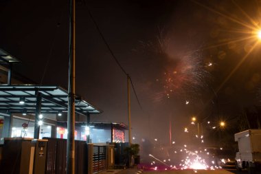 outdoor night scene of asian people celebrating chinese new year on the street.