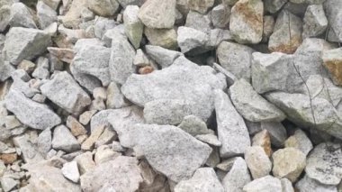 pile of broken granite stone on the outdoor farm.