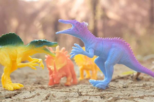 stock image infrared image of the dinosaur toys illustrating loitering around the dried land.