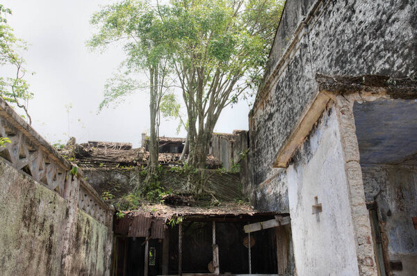 Outdoor scene of the deserted and dilapidated colonial buildings.