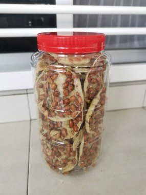 Rempeyek is a deep-fried savory make from rice flour, peanut and anchovies.