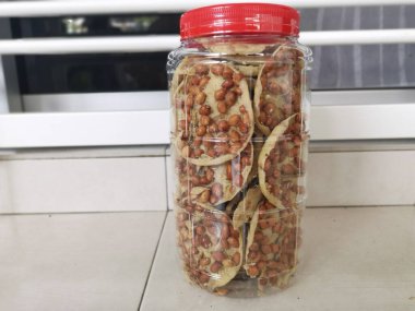 Rempeyek is a deep-fried savory make from rice flour, peanut and anchovies.