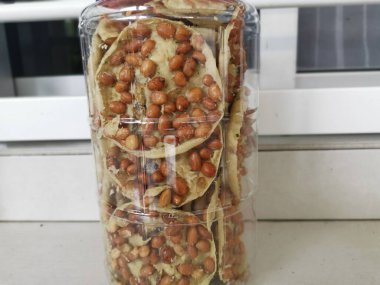 Rempeyek is a deep-fried savory make from rice flour, peanut and anchovies.