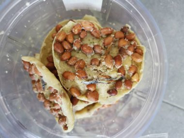 Rempeyek is a deep-fried savory make from rice flour, peanut and anchovies.