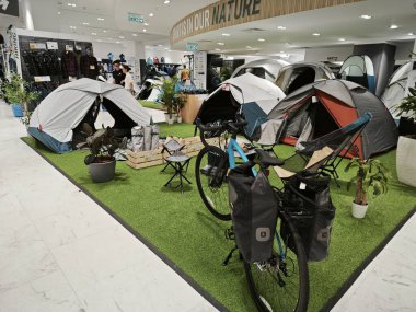 Kuala Lumpur, Malaysia. December 03, 2023: Scene of sport utilities and accessories on display and sale at indoor of Decathlon KL City Centre,Four Seasons Place. clipart