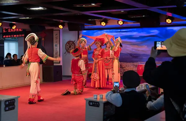 stock image Yunnan, China. April 20, 2024: Lake tour cruise tour traditional performance of Bai's three courses of Tea that demonstrate the tradition and lifestyle local ethnic people of Dali at Erhai Lake.