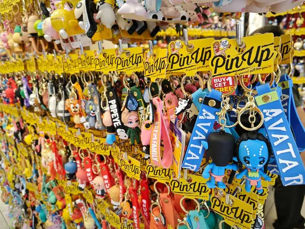 stock image Penang, Malaysia. August 11,2024: Display on the racks various rubber toy keychains wrapped in plastic bags for sale at Queen Bay Mall, Georgetown.