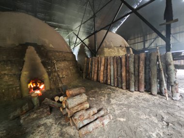 indoor scene of the igloo-shaped or kiln factory shed.  clipart