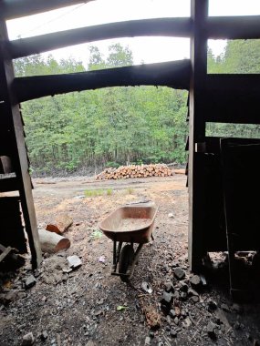 environment scene around the vicinity of opened field outside the old charcoal factory shed.   