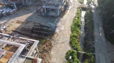 Perak,Malaysia. September 30, 2025: Footage of laborers working indoor and outdoor building up the new residential housing scheme at the Taman Indah Permai construction site. 