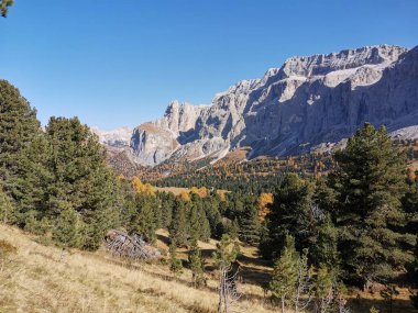 Scenic view of Passo di Sella mountain pass road in Italy during beautiful autumn