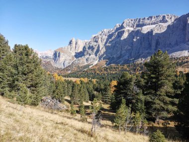 Scenic view of Passo di Sella mountain pass road in Italy during beautiful autumn