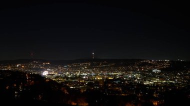 Stuttgart inner city, downtown with ferry wheel by night in winter during Christmas Market Weihnachtsmarkt