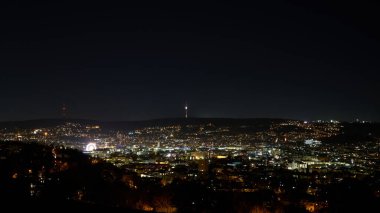 Stuttgart inner city, downtown with ferry wheel by night in winter during Christmas Market Weihnachtsmarkt