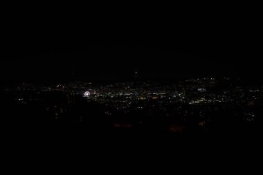Stuttgart inner city, downtown with ferry wheel by night in winter during Christmas Market Weihnachtsmarkt