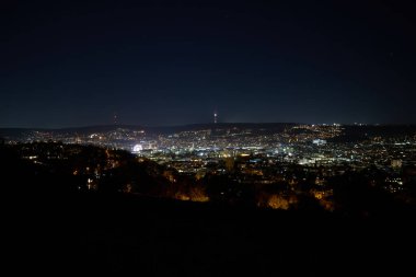 Stuttgart inner city, downtown with ferry wheel by night in winter during Christmas Market Weihnachtsmarkt