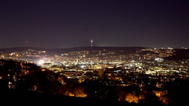 Stuttgart inner city, downtown with ferry wheel by night in winter during Christmas Market Weihnachtsmarkt
