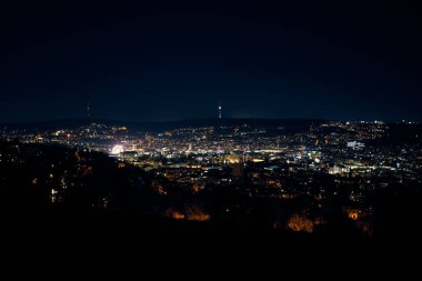 Stuttgart inner city, downtown with ferry wheel by night in winter during Christmas Market Weihnachtsmarkt