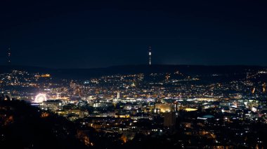 Stuttgart inner city, downtown with ferry wheel by night in winter during Christmas Market Weihnachtsmarkt