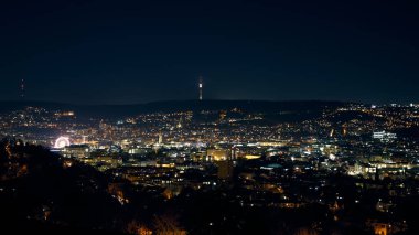Stuttgart inner city, downtown with ferry wheel by night in winter during Christmas Market Weihnachtsmarkt