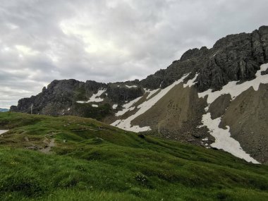 beautiful valley at the fiderepass hut in the alps clipart