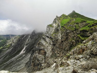 beautiful foggy mountain area with dark and bright light spaces clipart