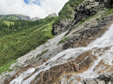 waterfall in a mountain valley near mindelheimer hut clipart