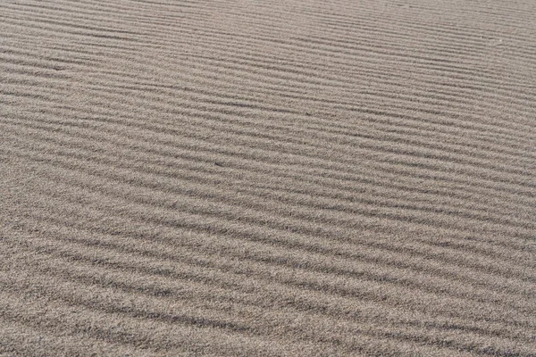 Světle Hnědý Písek Textura Pozadí Větrný Den Pláži Vzor Abstraktní — Stock fotografie