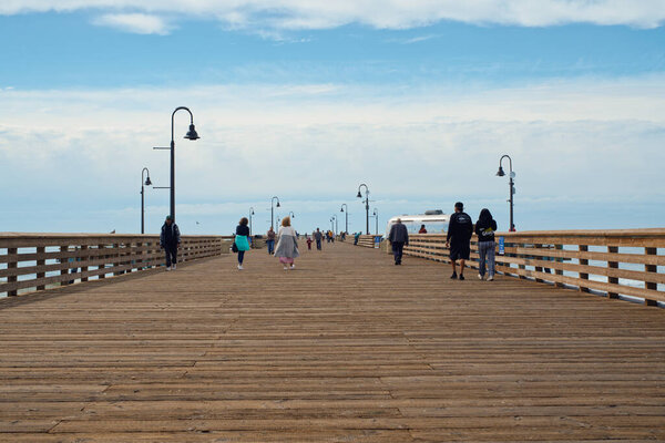 Pismo Beach, California, USA - March 3, 2022. Pismo Beach pier, an old wooden pier in the heart of Pismo Beach city, California