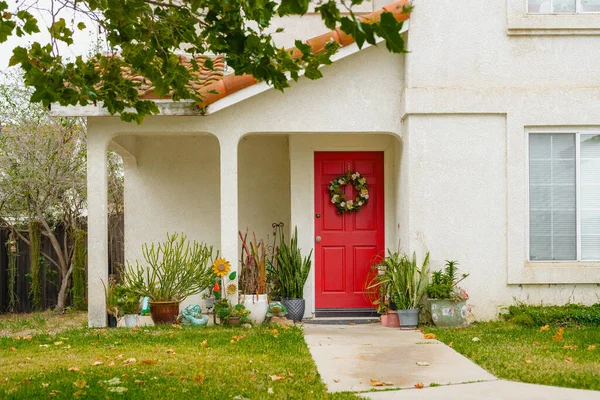 House entrance, front door, decorations, and  a beautifully landscaped front yard somewhere in California