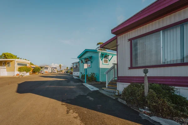 Mobile home park. A row of residential mobile park homes in a small town somewhere in California. Lifestyle, architecture, street view