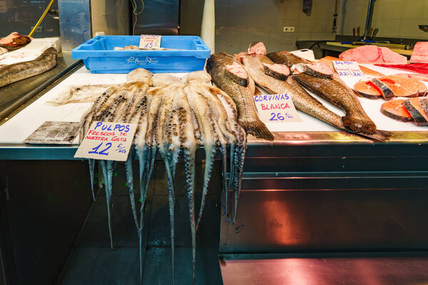 Huelva, Spain - January 11, 2024. Seafood market, brimming with an array of fresh fish, squid, shrimp, mollusks, and more, each displaying the bounty of the sea