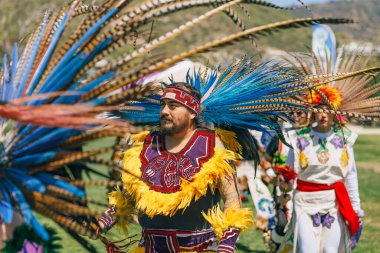 Malibu, California. April 6, 2024.  Powwow. Native Americans dressed in full regalia. Details of regalia close up. Chumash Day Powwow clipart