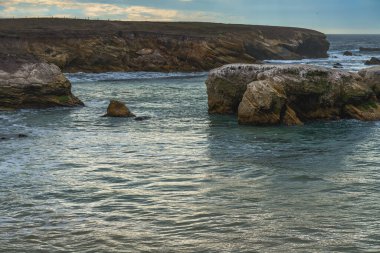 Atmospheric coastal scene. Montana de Oro at sunset, California Central Coast clipart