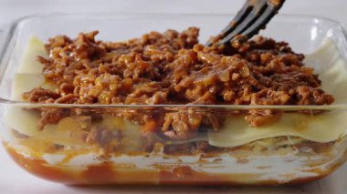 Layers of meat sauce and pasta in lasagna dish. High quality 4k footage