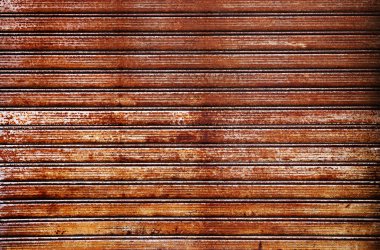 Eski ve paslı çinko çarşaf duvarının artistiği. Klasik stil metal yaprak çatı dokusu. Eski metal levha deseni. Paslı metal ya da yanlamasına. Galvanizasyon aşınması. Geçmiş kavramında arkaplan ve doku