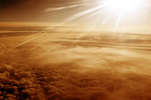 Heaven with sun light rays or beams bursting from clouds in blue sky. Spiritual religious background. Realistic tranquil cloudscape view, beautiful sky paradise backdrop