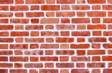 Duvarcılık. Yatay tuğla duvar panoraması. Kırmızı tuğla deseni. Kırmızı eski ve yıpranmış tuğla duvarın arka planı.
