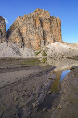 Antermoia lake, a glacial lake in Antermoia valley, Dolomites, South Tyrol, Italy clipart