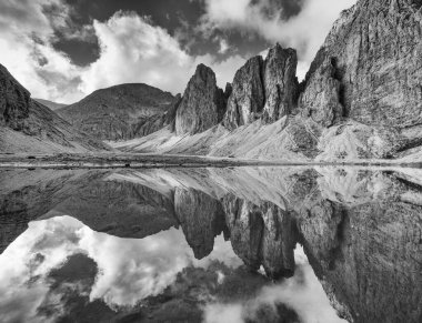 Antermoia lake, a glacial lake in Antermoia valley, Dolomites, South Tyrol, Italy clipart