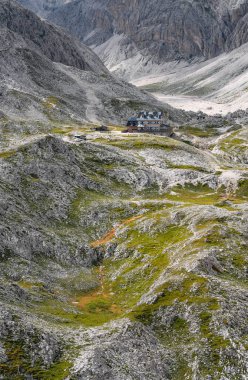 Scenic landscape of Rifugio Antermoia in Antermoia valley, Dolomites, South Tyrol, Italy, Europe clipart