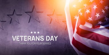 Gaziler günü konsepti. Gri arkaplanda Amerikan Bayrağı ve metin için boş alan.