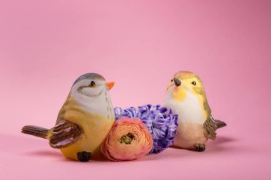Floral Composition with Decorative blue Tit birds, purple hyacinth and yellow Buttercup flowers with empty copy space. Happy Easter, or Mothers day concept.