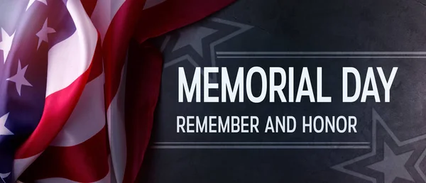 Memorial Day Banner with the United States official flag against the dark grey background. Remembrance day backdrop.